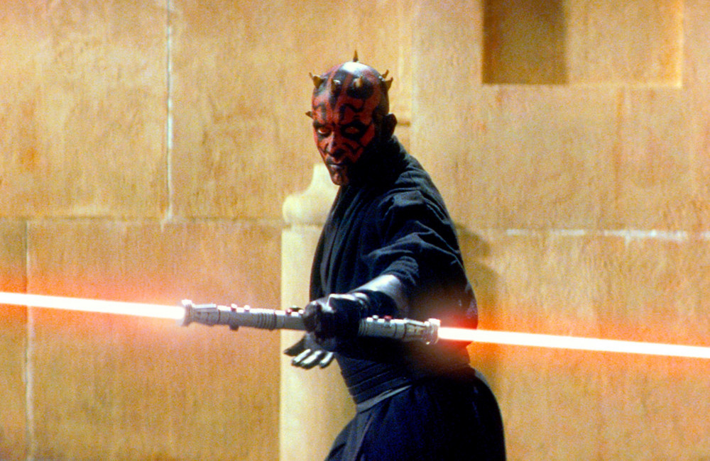 As one of the most terrifying Sith Lords in the galaxy, Darth Maul took the fandom by storm when he debuted in ‘The Phantom Menace’, and its clear to see why. Everything about his design screams ‘evil’, but unfortunately, his voice didn’t match his ominous appearance.  Ray Park, who played the character, had a high, rural English accent that George Lucas decided wasn’t intimidating enough, so the director instead dubbed him with the voice of comedian Peter Serafinowicz.