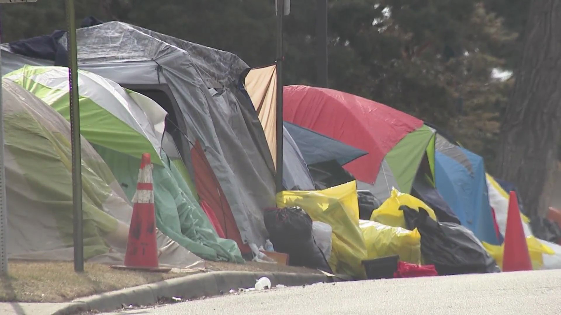 Migrant advocates seek tents, donated gear from swept encampment