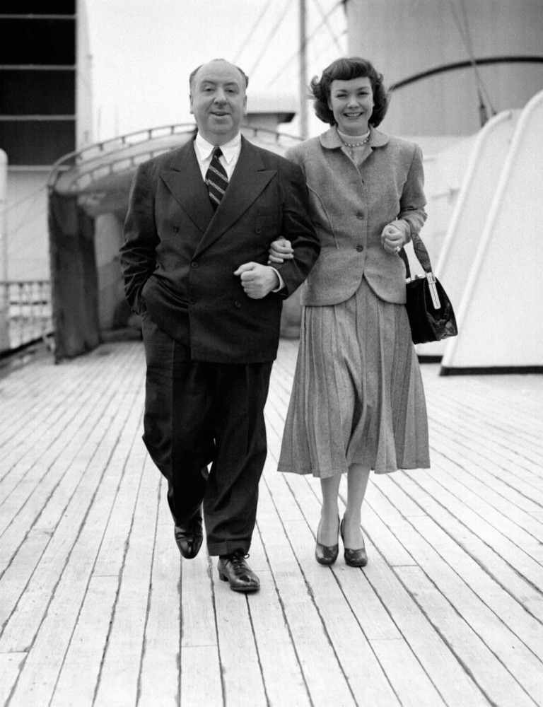 <p>Alfred Hitchcock and film star Jane Wyman (one-time wife of future president Ronald Reagan) are photographed aboard the Cunard liner RMS <em>Queen Mary</em> in 1950 as it leaves Southampton for New York. The Queen Mary is today permanently moored in Long Beach, California, as a floating hotel.</p>