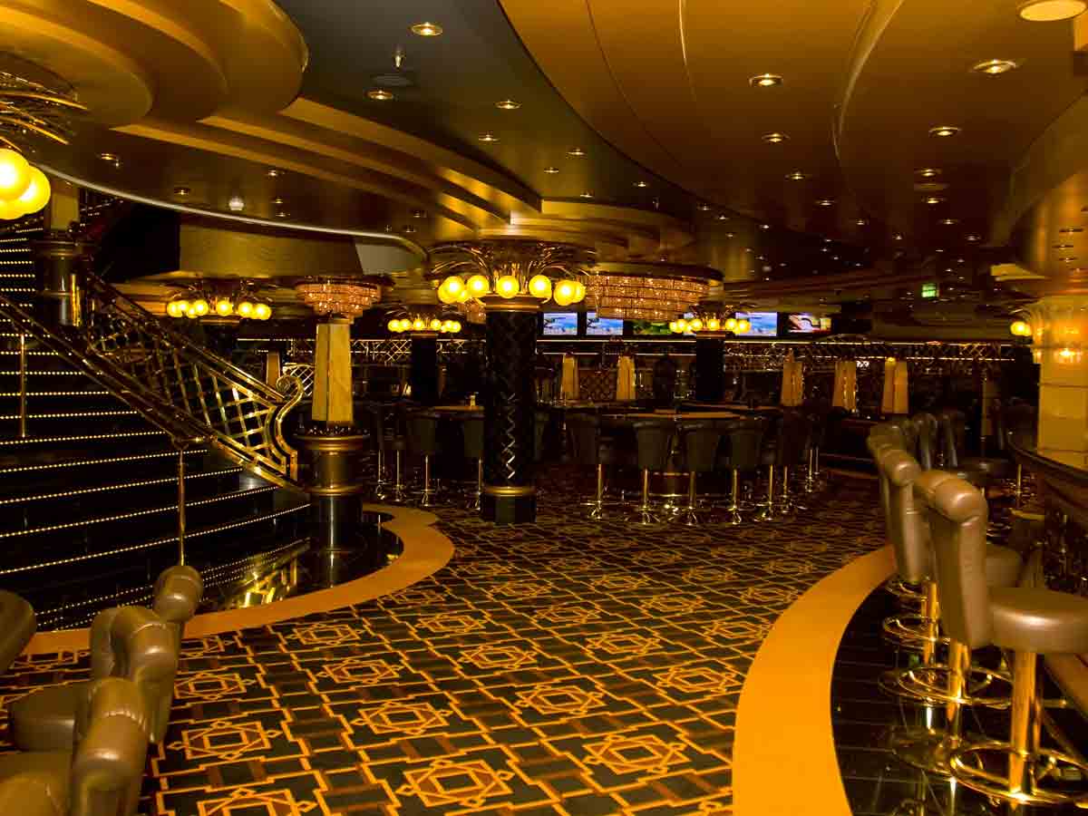 <p>The casino is in a room that’s roughly 10’ x 20’, but the double door opening is deceiving. There are a lot of machines, noise, neon, and mirrors—all to make it appear as a bustling casino environment. </p> <p>First of all, your room key will be tied to a credit card you left on file, so gambler beware. There are also ATMs adjacent, so you can pull out money from a different source.  Roughly 1/3 of the folks are trying to get in, and the drinks aren’t free.  </p>