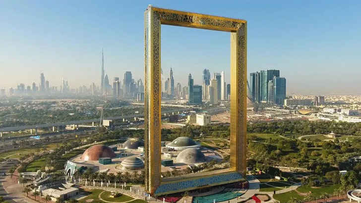 <p>Fancy yourself taking your own postcard pic? Well look no further than the Dubai Frame, which sits metaphorically at the border between the new and old cities of Dubai. At almost 500 feet tall, you can actually travel up it in the panoramic glass elevators and walk across the glass walkway that spans the width. The gold frame is said to be the largest in the world, and is a great photo-op itself with the cityscape in the background.</p>