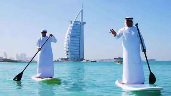 <p>Even traditional Arab garb won’t stop some people from enjoying the beach life. Dubai’s aquamarine waters are so gorgeous and so enticing that you’ll find people on watercraft of all sorts surfing about.</p>