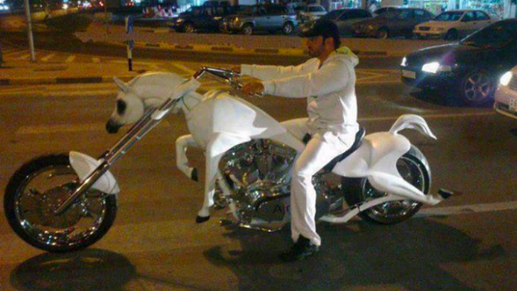 <p>What do you get when you cross a merry-go-round with a chopper? You get normal Dubai traffic. Sights like this are not as uncommon as you might assume, but notice how he doesn’t have some gorgeous babe on the back. Wonder why that could be.</p>
