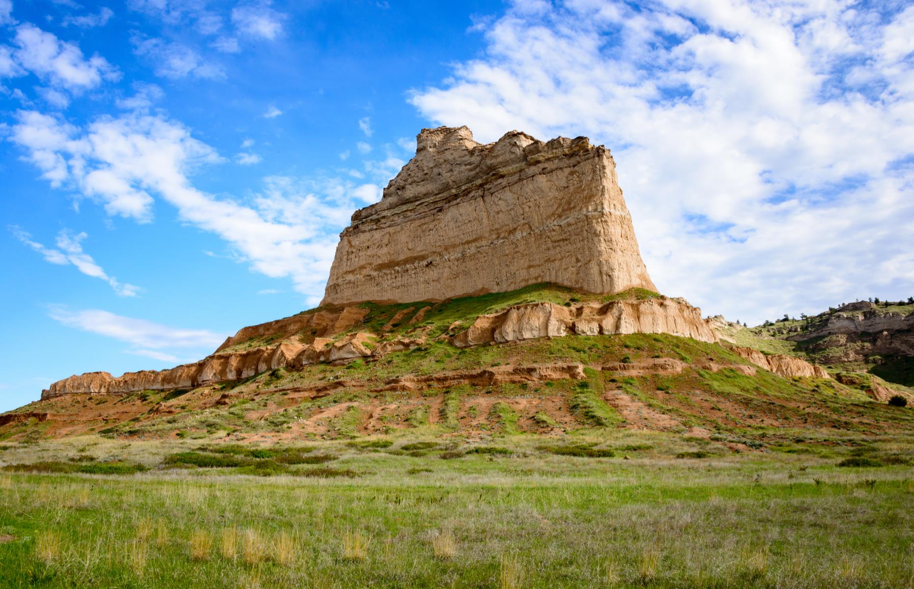 <p>A mighty crag in the American Midwest, Scotts Bluff towers some 800 feet above the plains of western Nebraska, and holds great significance. Though little evidence remains, it’s thought that early Indigenous tribes once camped in the wake of the bluff, while westward emigrants following the Oregon, California and Mormon Trails in the 19th century would have gazed up at its great expanse. The Oregon Trail Museum and Visitor Center breathes life into these historic journeys, while the 1.6-mile Summit Road winds right to the top of the peak.</p>