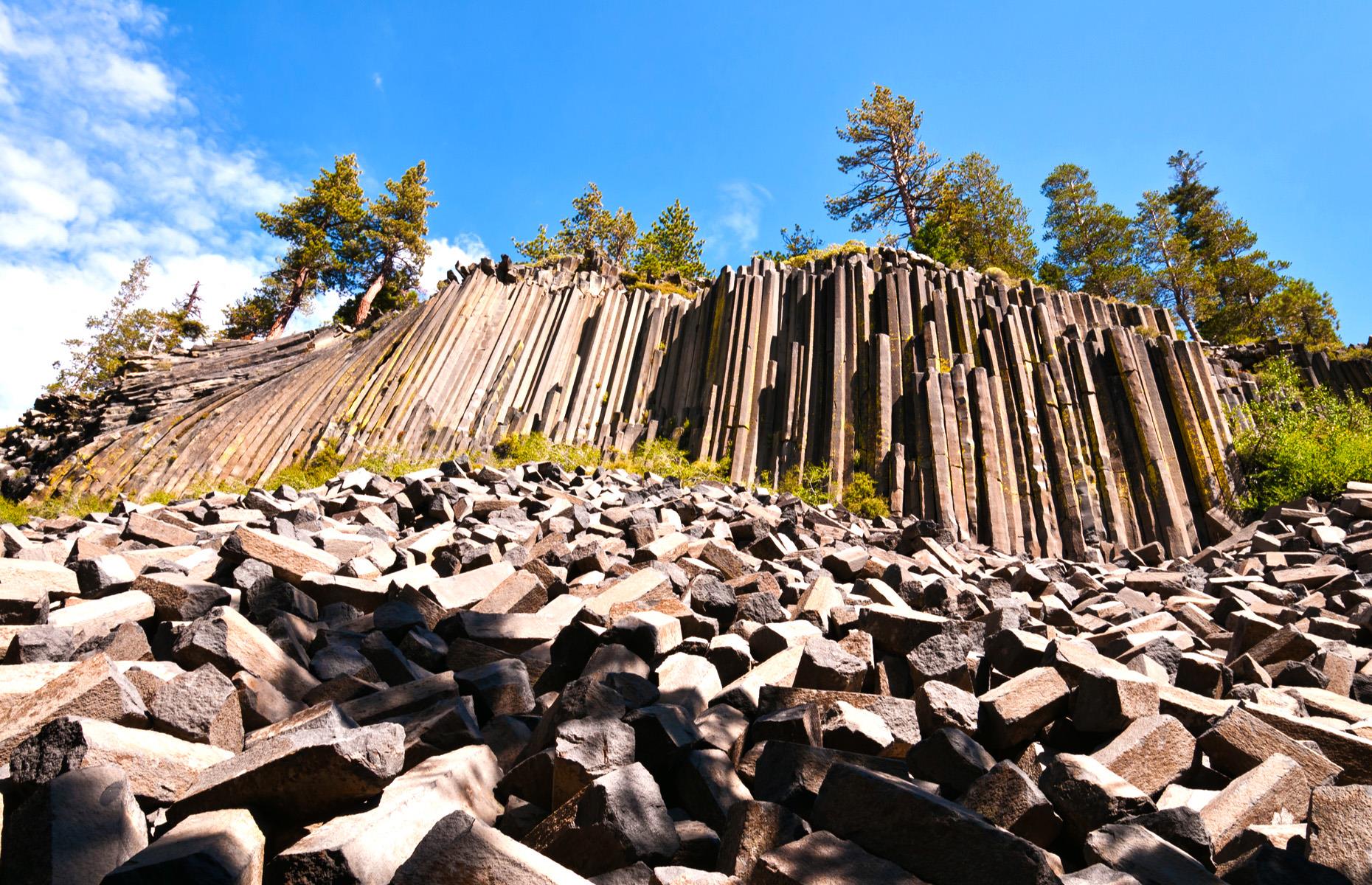 <p>This National Monument is one of the finest geological wonders in California – and that’s no small feat in a state home to the great granite bulks of Yosemite National Park. Formed many thousands of years ago by cooling lava and bearing some resemblance to Wyoming’s Devils Tower, the Devils Postpile is a giant columnar basalt bluff. This monument also protects the 101-foot Rainbow Falls and wildlife-rich grasses and mountain peaks.</p>