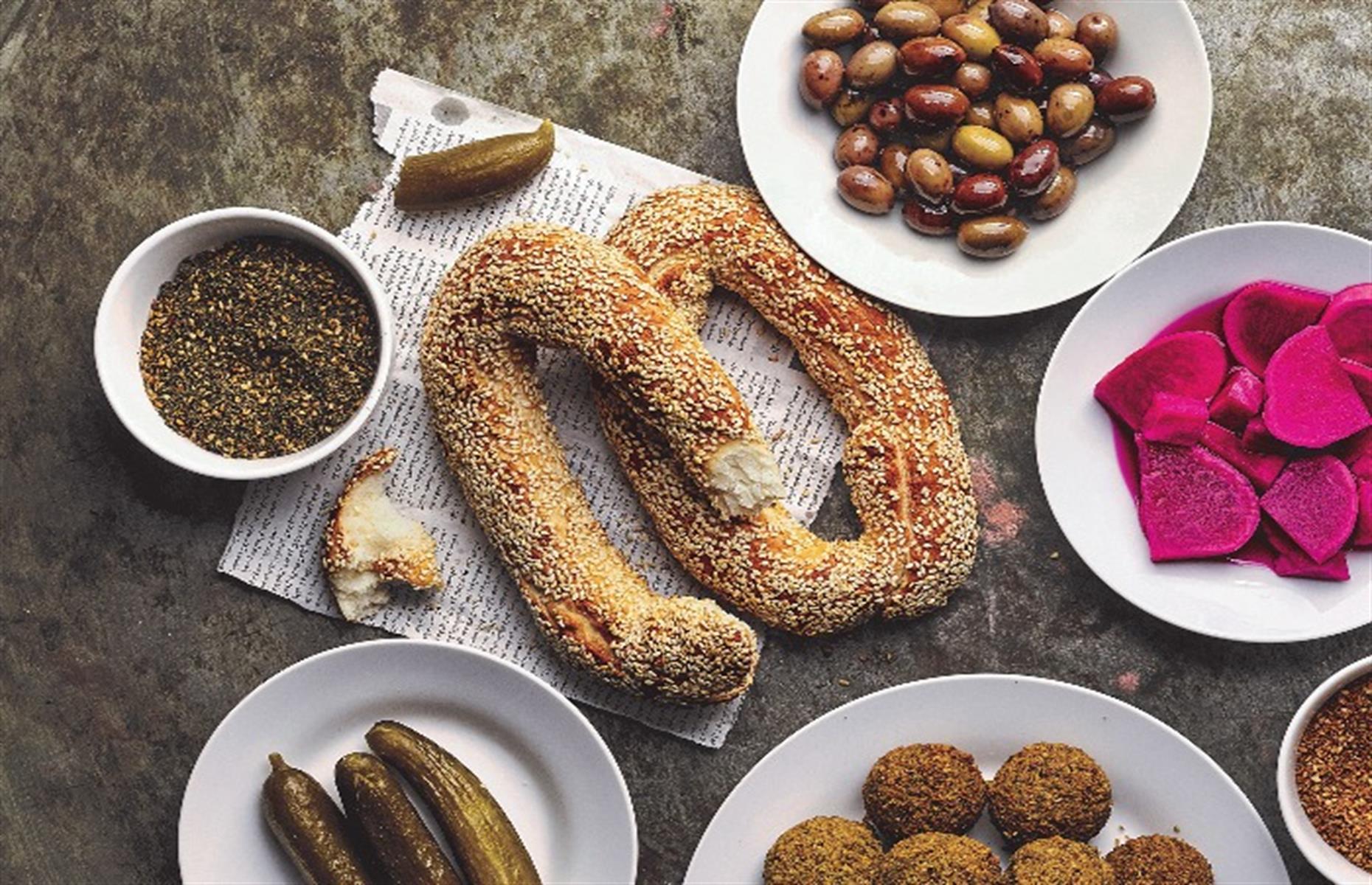 <p>A bagel with a difference, these oblong-shaped Palestinian breads are coated with a sticky, sesame seed glaze. They’re easy to make and, unlike classic New York–style bagels, don't require poaching in water. Serve as part of a mezze platter with pickles, dips, falafel, and olives, and pop any leftovers in the freezer.</p>  <p><a href="https://www.lovefood.com/recipes/71600/sesame-bagels-recipe"><strong>Get the recipe for sesame bagels here</strong></a></p>