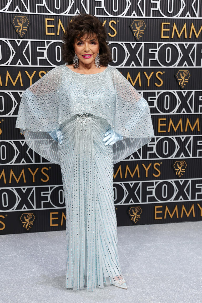 Joan Collins, 90, sparkles on the Emmys 2024 red carpet in blue