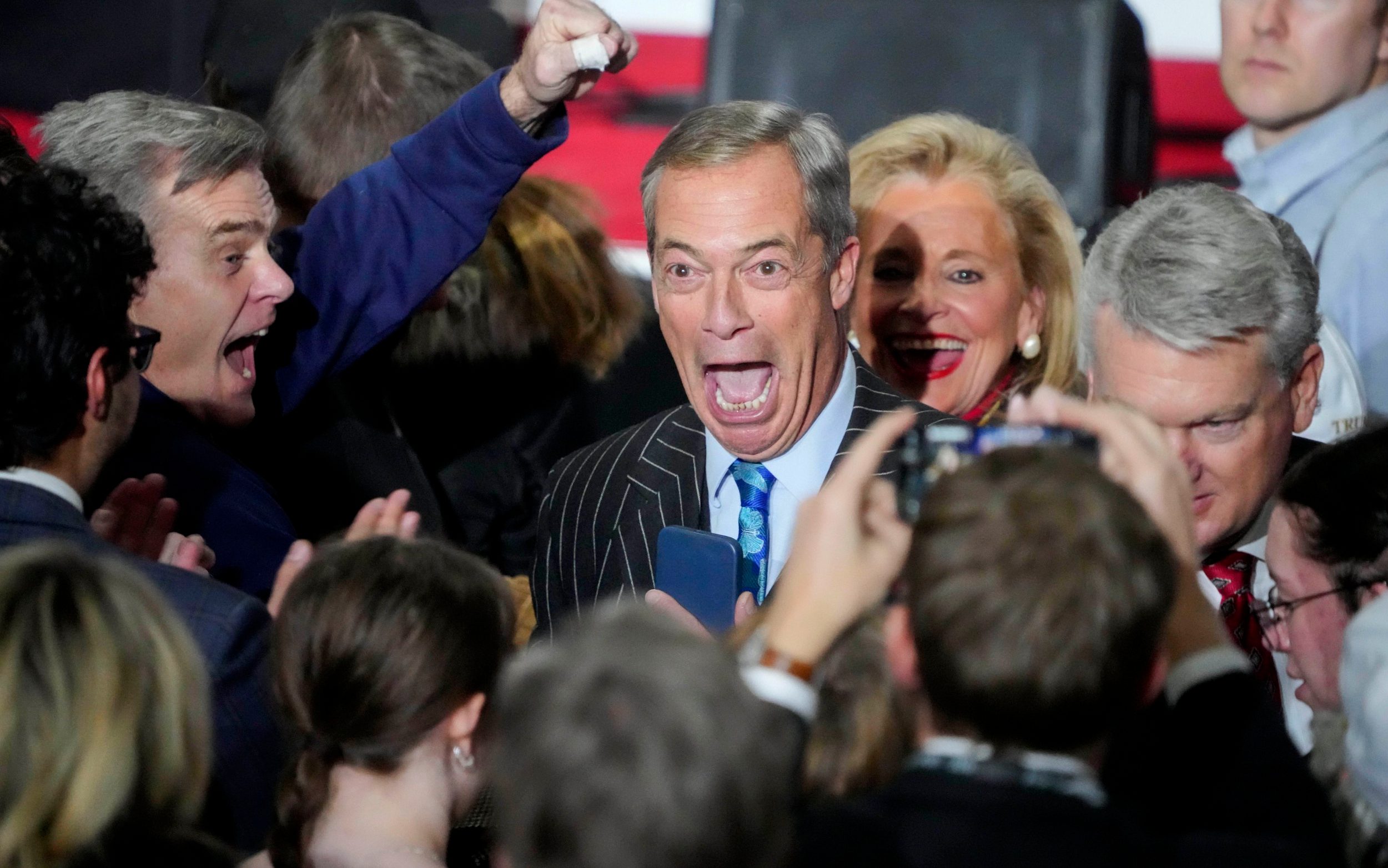 'Handsome' Nigel Farage Makes Surprise Appearance At Trump's Victory Party