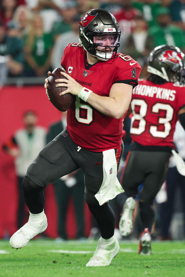 Jan 15, 2024; Tampa, Florida, USA; Tampa Bay Buccaneers quarterback Baker Mayfield (6) scrambles during the first half of a 2024 NFC wild card game against the Philadelphia Eagles at Raymond James Stadium. Mandatory Credit: Kim Klement Neitzel-USA TODAY Sports NFL: NFC Wild Card Round-Philadelphia Eagles at Tampa Bay Buccaneers