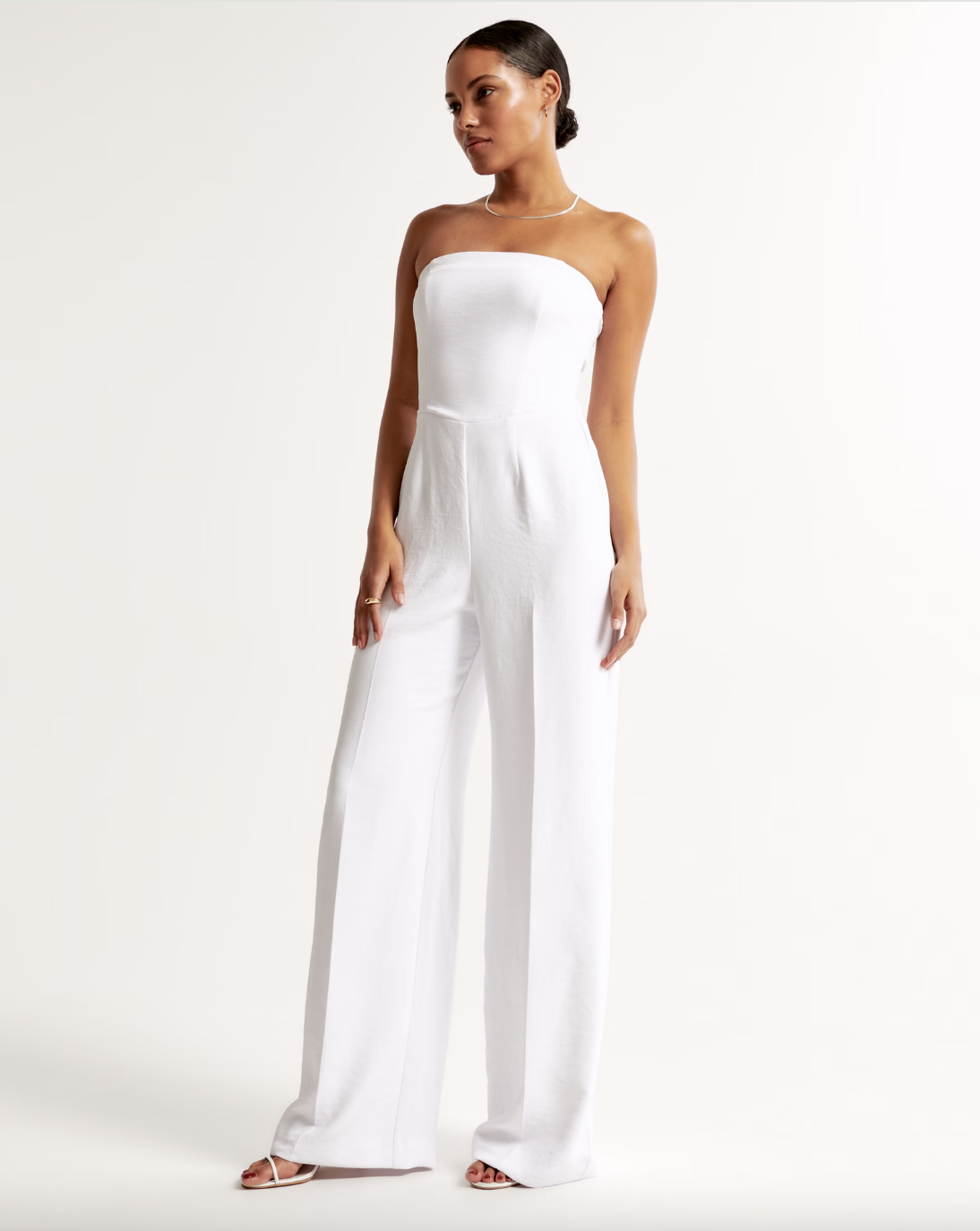 <p><strong>$100.00</strong></p><p><a href="https://www.abercrombie.com/shop/uk/p/strapless-premium-crepe-jumpsuit-53418840">Shop Now</a></p><p>New in at Abercrombie, this wedding jumpsuit is one of the comfiest styles out there. It has corset-style seams and extra wide legs, as well as handy detachable straps so you can switch up your look. We guarantee you'll wear this one post-nuptials too – like, every summer, probs. </p>