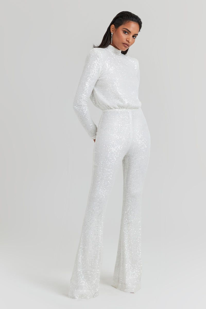 <p><strong>£345.00</strong></p><p><a href="https://www.nadinemerabi.com/products/heidi-white-jumpsuit">Shop Now</a></p><p>Perfect for wedding receptions, engagement parties and <a href="https://www.cosmopolitan.com/uk/fashion/style/a45555435/hen-do-outfits/">hen-dos</a> alike, this Nadine Merabi jumpsuit is a little work of art. Covered in thousands of white sequins, this high-necked number turns to reveal a cut-out back. </p>