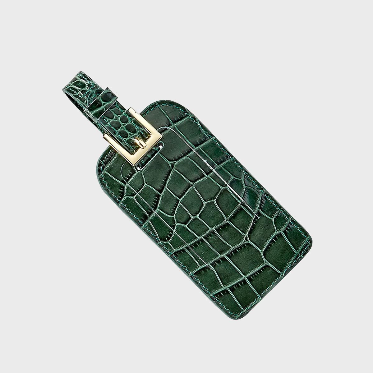 <p>What's better than a leather luggage tag? A <a href="https://www.neimanmarcus.com/p/graphic-image-luggage-tag-prod246490672" rel="noopener">croc-embossed tag</a>. It secures with a buckle and has a hidden pocket for your information card. Just wipe it down to maintain its shine. Packing for an international getaway? Here are the things you should <a href="https://www.rd.com/list/things-never-to-forget-when-traveling-overseas/">never forget when traveling overseas</a>.</p> <p class="listicle-page__cta-button-shop"><a class="shop-btn" href="https://www.neimanmarcus.com/p/graphic-image-luggage-tag-prod246490672">Shop Now</a></p>