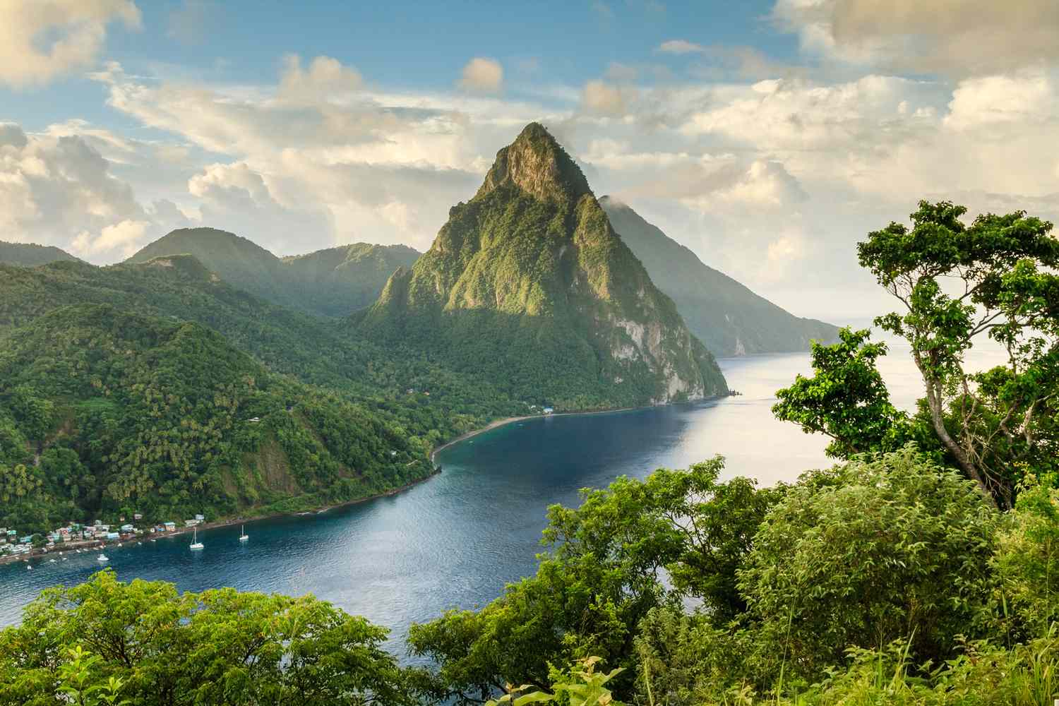 <p><span><span><span><span><span><span>The Pitons, rising dramatically from the Caribbean Sea on the island of St Lucia, present a breathtaking landscape that is both iconic and awe-inspiring. These twin volcanic spires, Gros Piton and Petit Piton, punctuate the island's southwestern coast, creating a UNESCO World Heritage site and a symbol of St Lucia's natural beauty.</span></span></span></span></span></span></p>  <p><span><span><span><span><span><span>Gros Piton, the taller of the two, stands at 2,619 feet, while Petit Piton reaches 2,461 feet, creating a mesmerizing scene that attracts adventurers, nature enthusiasts, and photographers alike. The Pitons are not just geological marvels; they embody the spirit of the Caribbean, offering a playground for hiking, bird-watching, and underwater exploration.</span></span></span></span></span></span></p>  <p><span><span><span><span><span><span>The viewpoint from the summit of Gros Piton provides a panoramic reward for the trek. It reveals St Lucia's coastline, the Caribbean Sea, and neighboring islands.</span></span></span></span></span></span></p>