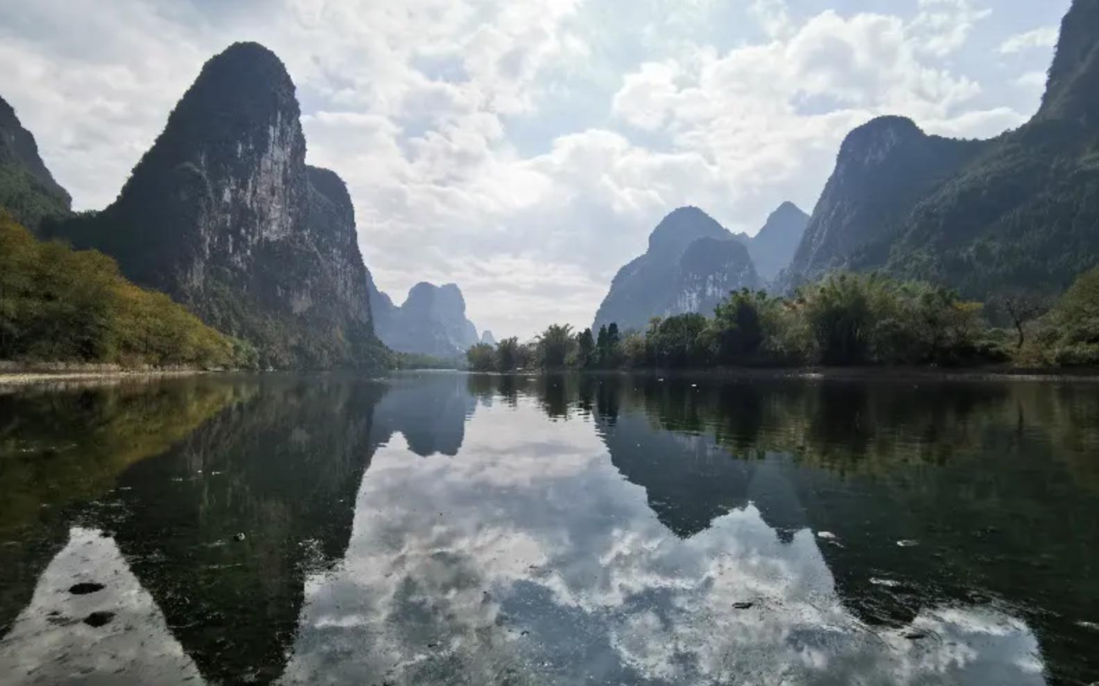 <p><span><span><span><span><span><span>The Li River in Guilin, China, looks like it was plucked from a traditional Chinese painting. The iconic karst peaks rise majestically from the waters, creating a landscape that has inspired poets and artists for centuries.</span></span></span></span></span></span></p>  <p><span><span><span><span><span><span>A river cruise along the Li River is a journey into another realm. The reflections of the limestone peaks in the tranquil waters, shrouded in mist during the early morning or bathed in the warm glow of the setting sun, evoke a sense of timeless serenity. Fishermen on bamboo rafts add a touch of cultural authenticity to the scene.</span></span></span></span></span></span></p>  <p><span><span><span><span><span><span>The scenic beauty of the Li River has made it a symbol of Guilin's natural wonders. The picturesque landscapes, with names like Elephant Trunk Hill and Nine Horses Fresco Hill, contribute to the area's legendary charm. The Li River in Guilin offers an unforgettable and enchanting experience for those who have the privilege to witness its splendor.</span></span></span></span></span></span></p>