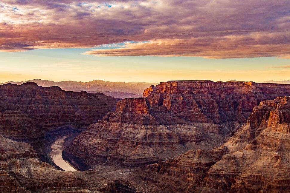 <p><span><span><span><span><span><span>The Grand Canyon in Arizona is a geological masterpiece, a breathtaking landscape sculpted over millions of years by the mighty Colorado River. This colossal chasm, stretching over 277 miles, exposes intricate layers of rock that tell a mesmerizing tale of Earth's ancient history.</span></span></span></span></span></span></p>  <p><span><span><span><span><span><span>The Grand Canyon's vastness overwhelms the senses as one gazes into its depths, where the play of sunlight reveals a spectrum of reds, oranges, and purples across the canyon walls. The South Rim, with its iconic vistas like Mather Point and Yavapai Observation Station, offers breathtaking views that stretch to the distant horizon.</span></span></span></span></span></span></p>  <p><span><span><span><span><span><span>Hiking trails, like the Bright Angel Trail, lead intrepid adventurers into the canyon's heart. It provides an immersive experience amidst the towering cliffs and unique rock formations.</span></span></span></span></span></span></p>