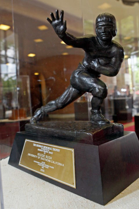 FILE – The Heisman Trophy, awarded to Reggie Bush in 2005, is seen in Heritage Hall during a meeting of University of Southern California football players on the campus in Los Angeles Thursday, June 10, 2010. Reggie Bush has been reinstated as the 2005 Heisman Trophy winner, Wednesday, April 24, 2024, more than a decade after Southern California returned the award following an NCAA investigation that found he received what were impermissible benefits during his time with the Trojans. (AP Photo/Reed Saxon, File)