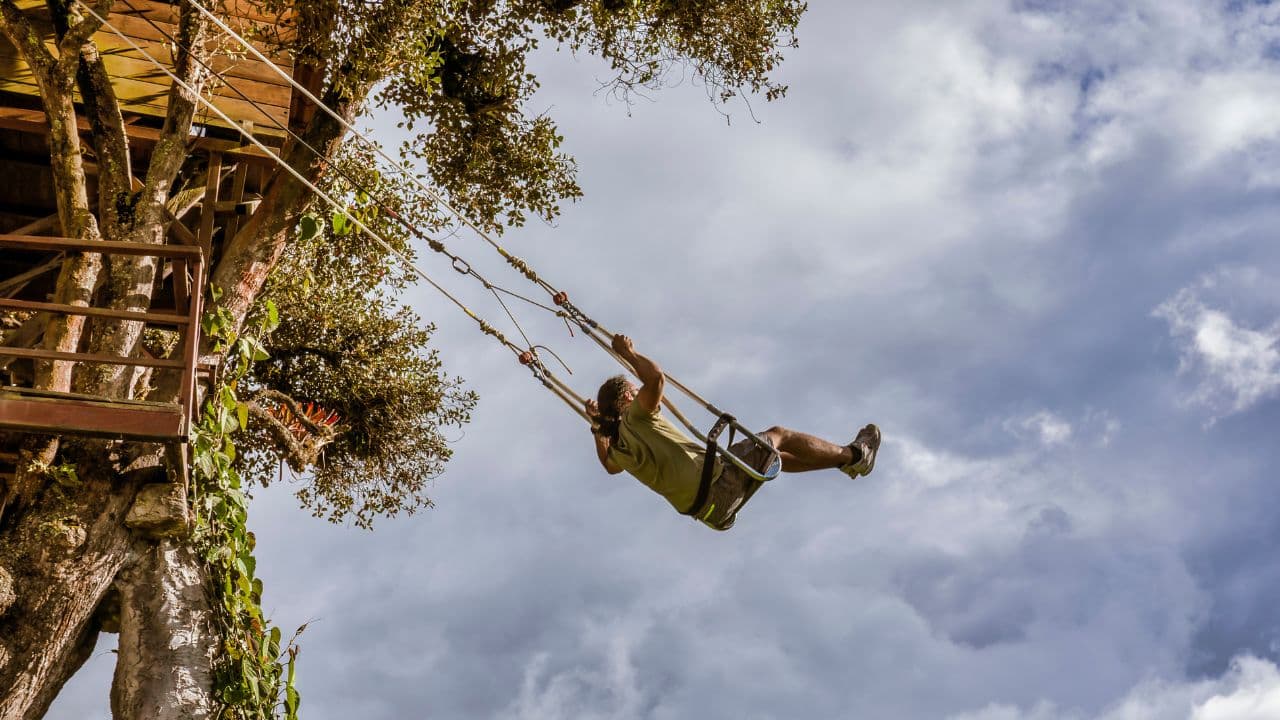 <p>One of the most popular <a href="https://explorersaway.com/things-to-do-in-banos-ecuador/">things to do near Baños</a>, the Swing at the End of the World is an incredible attraction that has gone viral hundreds of times over. This swing hanging from a treehouse is perched on a cliff overlooking a dramatic landscape, making swing out over the abyss an unforgettable and adventurous experience.</p>