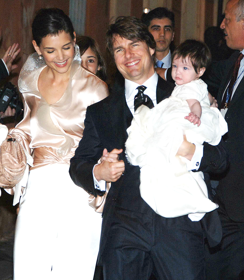 <p>Tom Cruise, soon-to-be wife Katie Holmes and their daughter Suri Cruise are seen leaving the Hassler Hotel in Rome on the way to their pre-wedding dinner. The trio looked so happy at the time. </p>