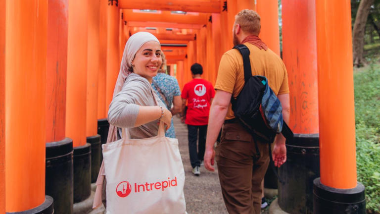 An Intrepid Travel group explores Kyoto's Fushimi Inari shrine.