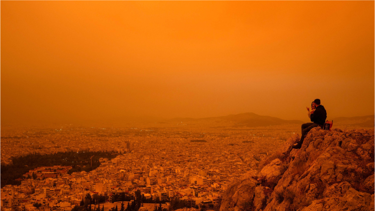 athens painted in orange-yellow hue following sahara dust storm