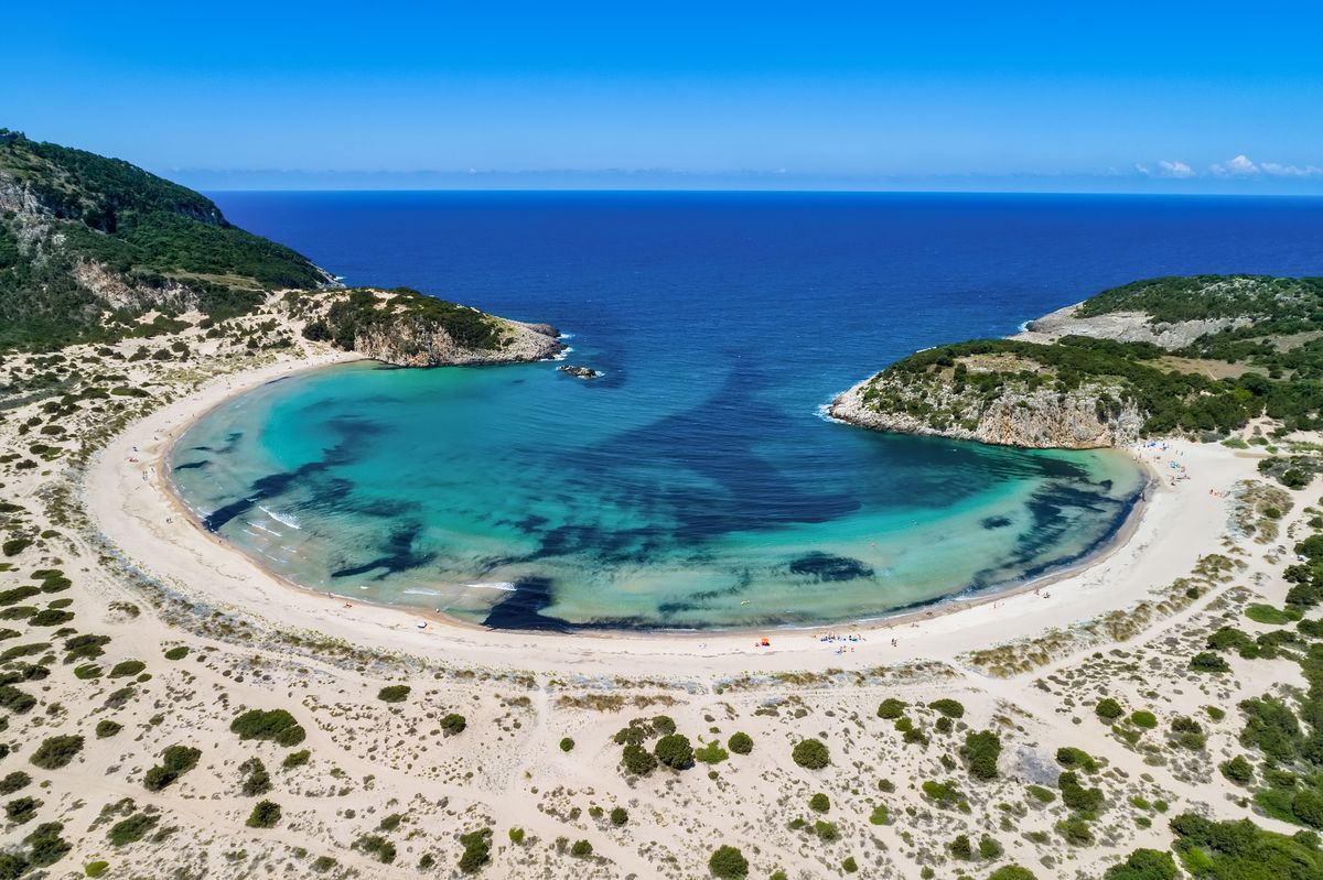 <p>For the <em><a href="https://www.youtube.com/watch?v=Kv6JWoVKlGY">Before Midnight</a></em> fans out there, this amphitheater-shaped beach is located in the heart of the Peloponnese. In addition to its aesthetic bona fides, the beach is said to be the home of Nestor’s Cave, the place where the deceitful god Hermes kept the cattle he stole from his half-brother Apollo.</p><p><a class="body-btn-link" href="https://go.redirectingat.com?id=74968X1553576&url=https%3A%2F%2Fwww.tripadvisor.com%2FAttraction_Review-g10137450-d2663285-Reviews-Voidokilia_Beach-Petrochori_Pylos_Nestor_Messenia_Region_Peloponnese.html&sref=https%3A%2F%2Fwww.elledecor.com%2Flife-culture%2Ftravel%2Fg60369620%2Fbest-beaches-greece-guide%2F">Shop Now</a></p>