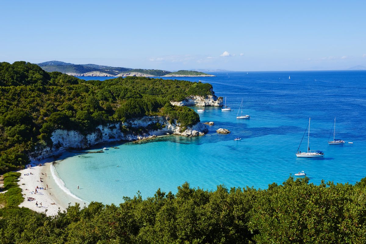 <p>Tucked away on the tiny island of Antipaxos, Voutoumi does a number on your eyeballs with its crystalline waters and powdery white sand, surrounded by lush green cliffs. It’s almost too perfect.</p><p><a class="body-btn-link" href="https://go.redirectingat.com?id=74968X1553576&url=https%3A%2F%2Fwww.tripadvisor.com%2FAttraction_Review-g12051721-d637884-Reviews-Voutoumi_Beach-Antipaxos_Ionian_Islands.html&sref=https%3A%2F%2Fwww.elledecor.com%2Flife-culture%2Ftravel%2Fg60369620%2Fbest-beaches-greece-guide%2F">Shop Now</a></p>