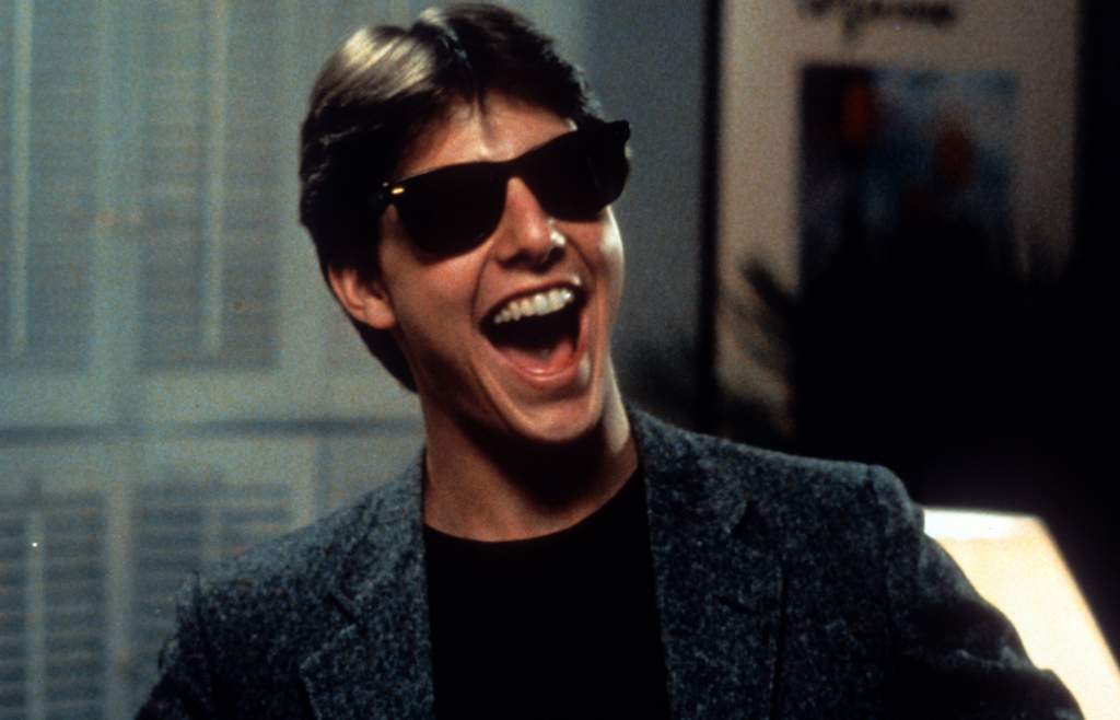 There is a moment during<em> Risky Business</em> when you can actually see Tom Cruise transform from a promising 20-year-old actor to a bonafide movie star. No, it isn’t the scene you're thinking of. The most iconic scene from the film is of course Cruise sliding into the frame and dancing to Bob Seger’s “Old Time Rock & Roll”. This is a moment that immediately entered pop culture and was parodied to death for decades. But the moment when Cruise truly becomes a star comes near the end of the film. Finishing a failed interview with a Princeton recruiter, he slaps on a pair of iconic Ray-Ban Wayfarers and, with a toothy grin, declares “Looks like it's the University of Illinois!” I think actual dollar signs appear on the screen. <br> <br> <em>Risky Business</em> is a solid teen comedy. Very much of it’s time. I’m not sure if it entirely holds up for modern audiences, but it's an important movie in charting Tom Cruise’s rise to fame.