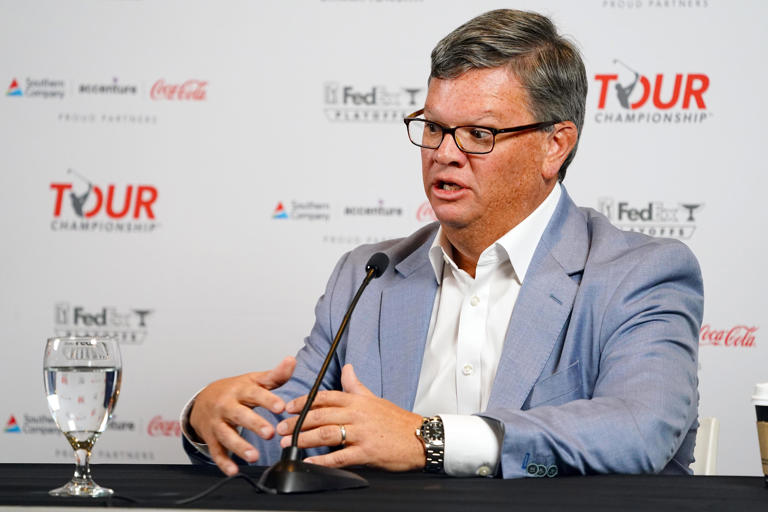 Tyler Dennis, Senior VP & Chief of Operations of the PGA Tour, takes questions from the media during a press conference ahead of the 2023 Tour Championship at East Lake Golf Club in Atlanta. (Photo: John David Mercer-USA TODAY Sports)