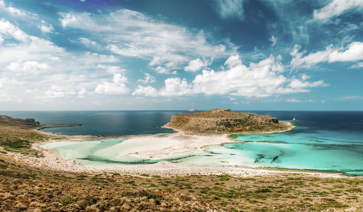 <p>Venturing to the northwestern coast of Crete gets you to the Balos, a beach endowed with crystal-clear waters and breathtaking landscapes. Nearby, there are historic sites aplenty, including the ancient city of Aptera, which features Minoan and Roman ruins, ancient walls, and a cistern.</p><p><a class="body-btn-link" href="https://go.redirectingat.com?id=74968X1553576&url=https%3A%2F%2Fwww.tripadvisor.com%2FHotel_Review-g1509156-d660021-Reviews-Balos_Beach-Kaliviani_Kissamos_Chania_Prefecture_Crete.html&sref=https%3A%2F%2Fwww.elledecor.com%2Flife-culture%2Ftravel%2Fg60369620%2Fbest-beaches-greece-guide%2F">Shop Now</a></p>