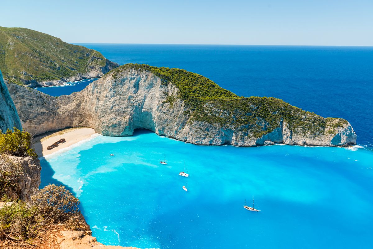 <p>Framed by towering limestone cliffs and accessible only by boat, Navagio, on the island of Zakynthos, is a flex. Getting there shows commitment, but once you’ve arrived, the social media content creates itself. </p><p><a class="body-btn-link" href="https://go.redirectingat.com?id=74968X1553576&url=https%3A%2F%2Fwww.tripadvisor.com%2FAttraction_Review-g189462-d23554626-Reviews-Navagio_beach-Zakynthos_Ionian_Islands.html&sref=https%3A%2F%2Fwww.elledecor.com%2Flife-culture%2Ftravel%2Fg60369620%2Fbest-beaches-greece-guide%2F">Shop Now</a></p>