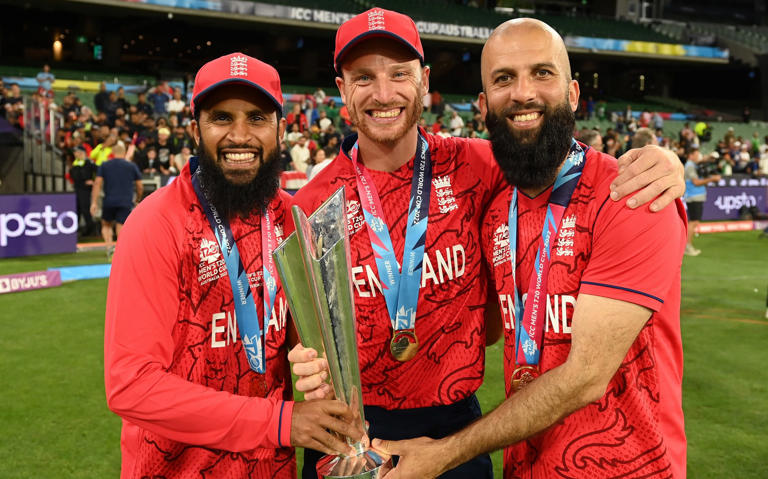 Adil Rashid (left), Jos Buttler (centre) and Moeen Ali celebrate England winning their second T20 World Cup in 2022 - Getty Images/Philip Brown