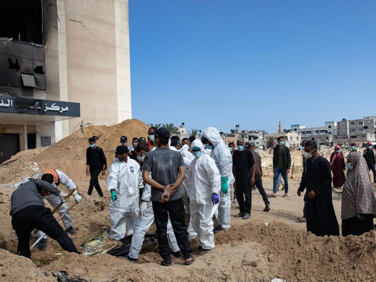 Searching for the dead as mass graves exhumed in Gaza