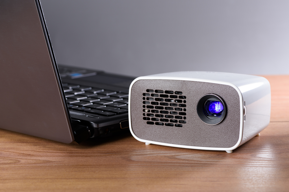 <p>Portable projectors like the Anker Nebula Capsule or the ViewSonic M1 are compact devices that allow you to project movies, videos, or presentations onto a wall or screen, ideal for outdoor movie nights or business presentations on the go. They offer features like built-in speakers, wireless connectivity, and battery operation. Average pricing ranges from $100 to $500.</p>
