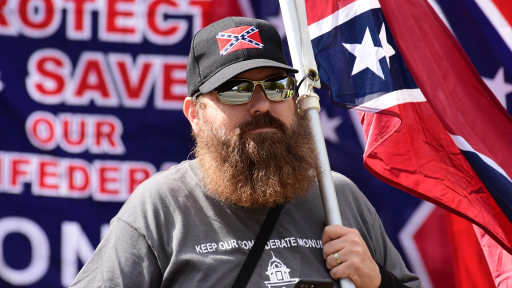 <p>Easterday reportedly stormed the east side of the Capitol building. He wore a black beanie with a logo that read "I [Heart] Trump."</p><p>According to the release, Easterday also carried a Confederate battle flag during the riot. Easterday was reportedly among the mob located outside of the East Rotunda doors at approximately 2:30pm.</p>