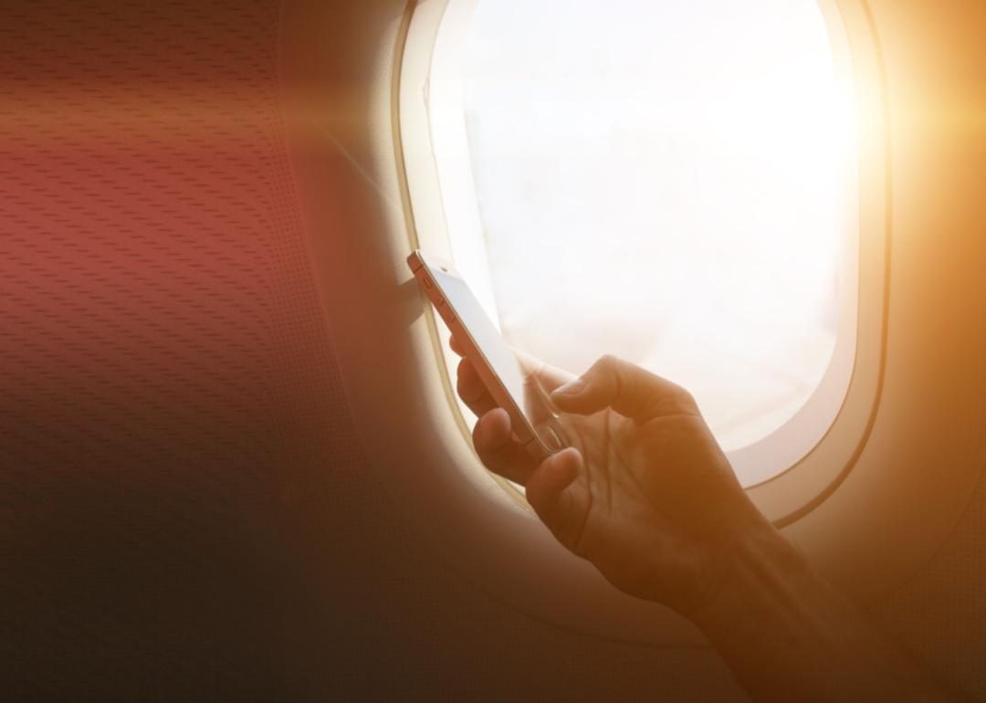 <p>The Federal Aviation Administration <a href="https://www.faa.gov/travelers/fly_safe/information">bans cell phone calls</a> on flights because of how the phone's signals interact with the plane's electronics. However, you can still use your phone if you put it in the aptly titled "airplane mode." This mode, which is standard on all modern smartphones, disables the phone's cellular connection as well as its Bluetooth and Wi-Fi capabilities. </p>  <p>It's worth keeping in mind that forgetting to turn on airplane mode is extremely unlikely to endanger your flight. As it turns out, according to a <a href="https://www.prnewswire.com/news-releases/americans-are-pro-connectivity-even-in-one-of-the-few-places-left-to-power-down-300555379.html">2017 survey by Allianz Global Assistance</a>, 2 in 5 people report leaving their cell service enabled on flights, and there's no evidence <a href="https://www.cnn.com/travel/article/cell-phones-devices-on-airplanes/index.html">signal interference from a cellphone</a> has ever caused a crash. It's still best to listen to the airline's guidance regarding cell phone use in-flight.</p>