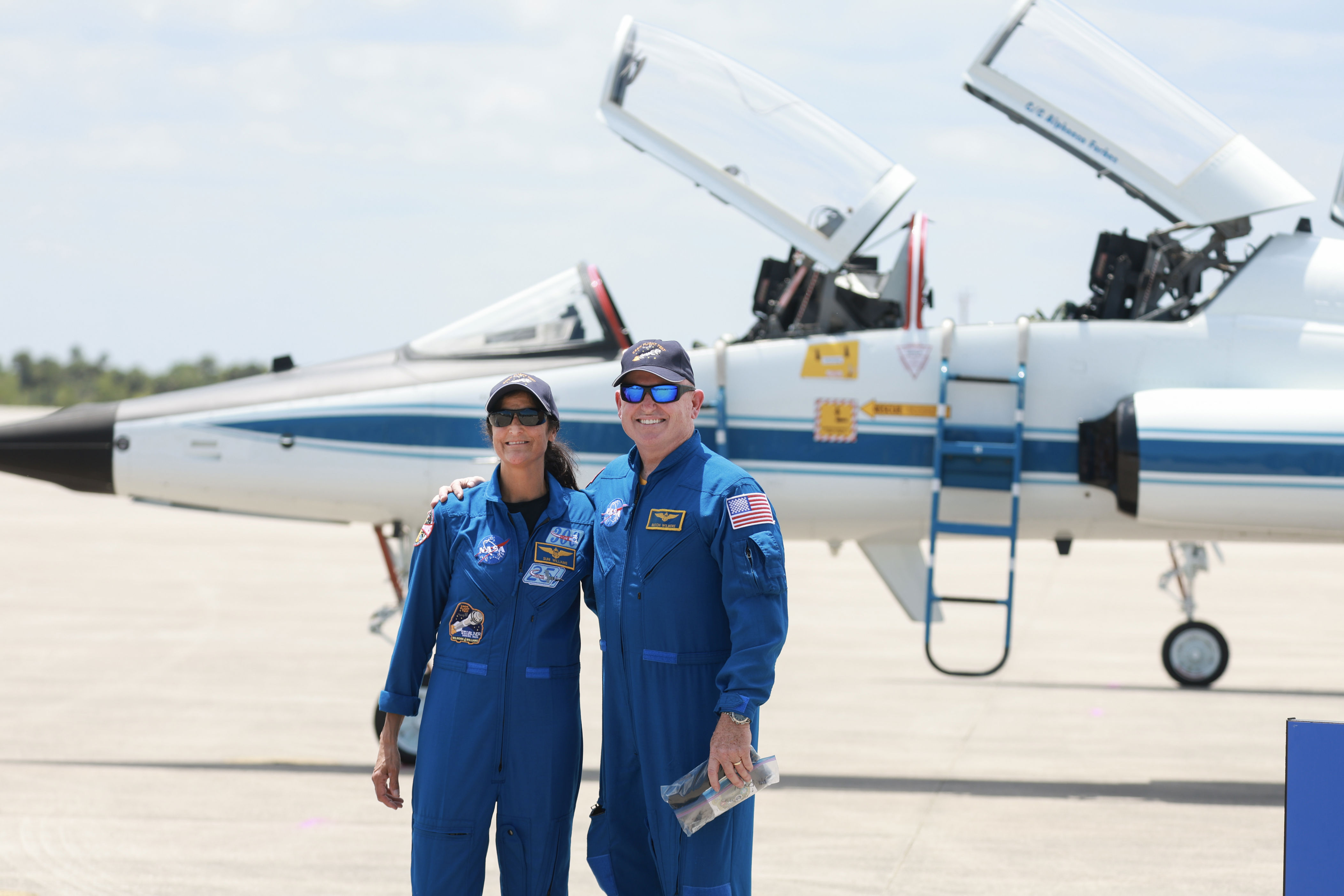 <p>NASA's Boeing Crew Flight Test Commander Butch Wilmore and Pilot Suni Williams posed to a photo while greeting the media following their arrival at the Kennedy Space Center in Cape Canaveral, Florida, in a T-38 jet on April 25, 2024. </p><p>They flew in for a mission aboard the Boeing Starliner that will take them to the International Space Station. </p><p>That launch is set to depart from the Cape Canaveral Space Force Station on May 6, 2024.</p>