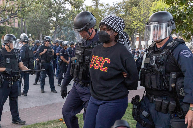 Members of the law enforcement and police officers intervene the Pro-Palestinian student protesters at the University of Southern California (USC) in Los Angeles, California, on April 24, 2024. USC on Thursday announced it would not be holding its main commencement ceremony this year out of safety concerns.