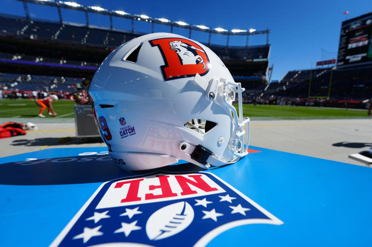 Detailed view of a White Cap edition Denver Broncos helme.