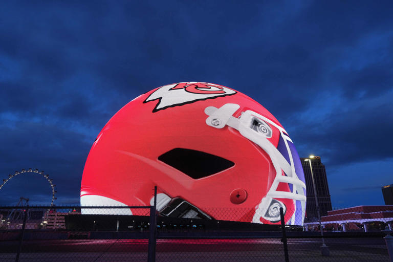 A Kansas City Chiefs helmet is projected onto the Sphere.