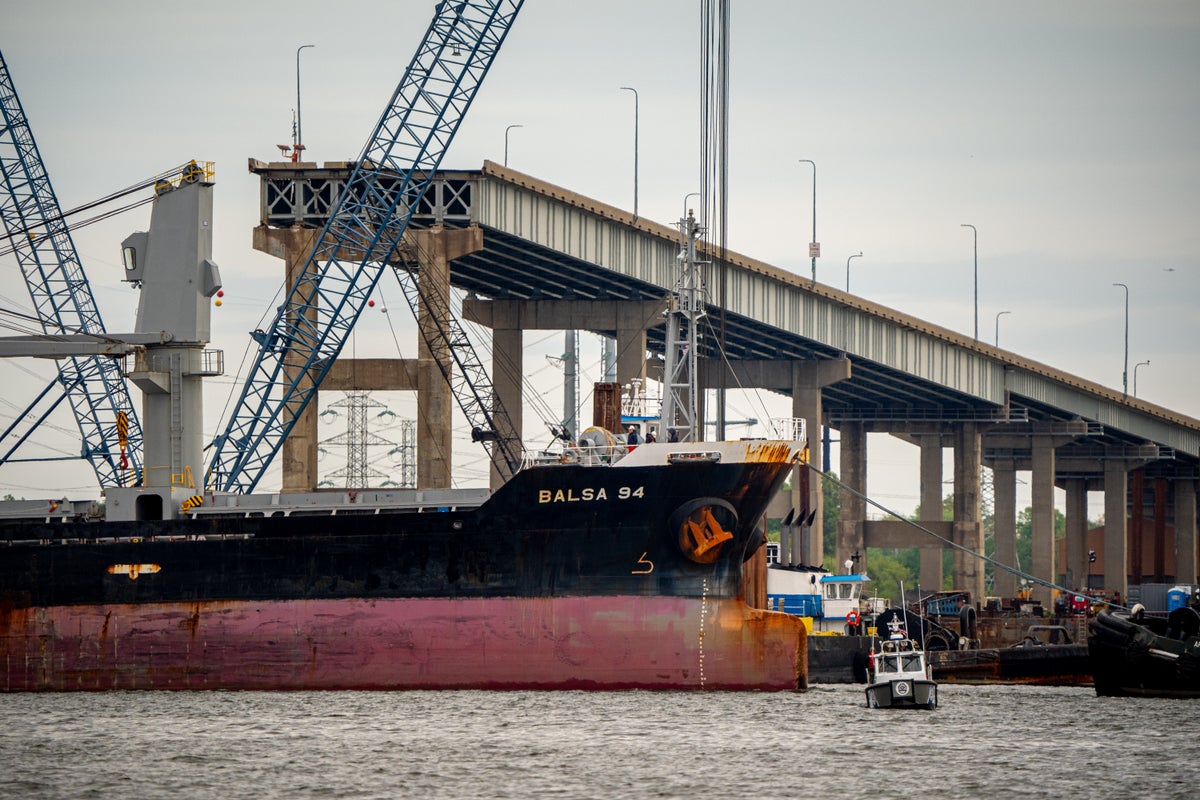 first cargo ships pass through baltimore bridge after collapse
