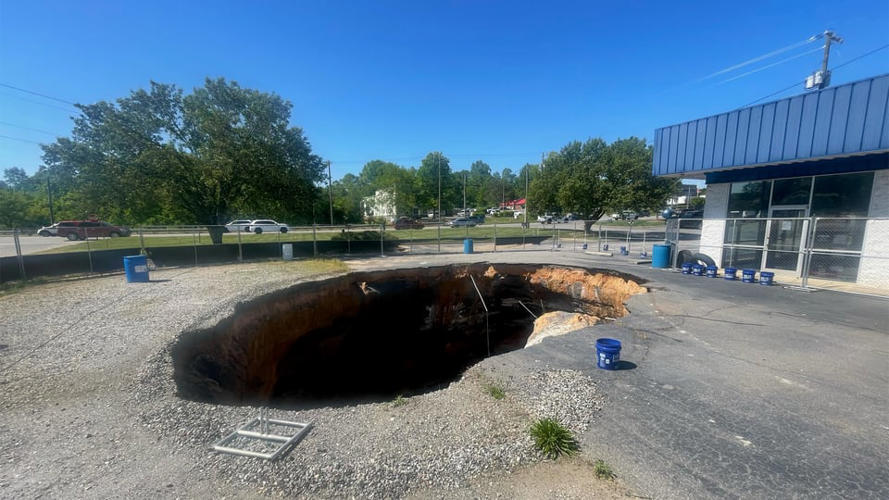 Owner forced to sell shop threatened by massive sinkhole in Mooresville