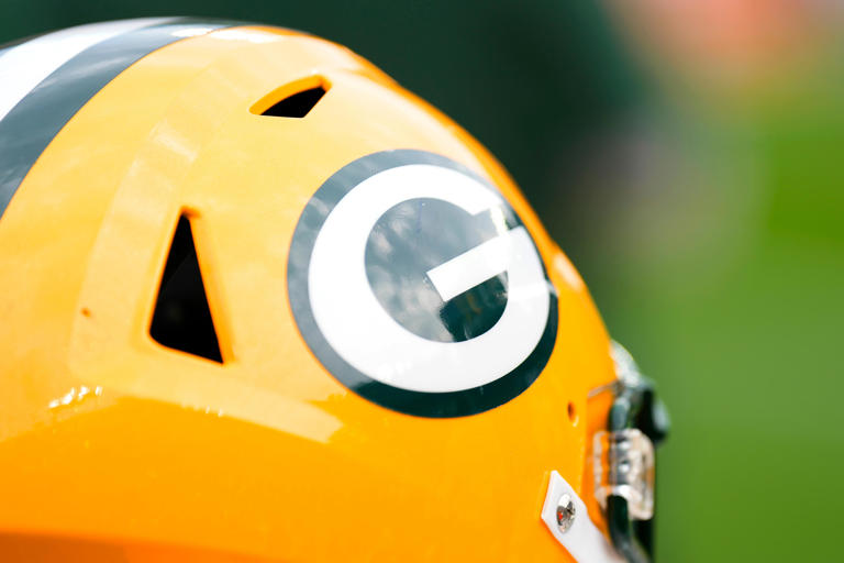 A Green Bay Packers helmet sits on the sidelines during the game against the New Orleans Saints at Lambeau Field.