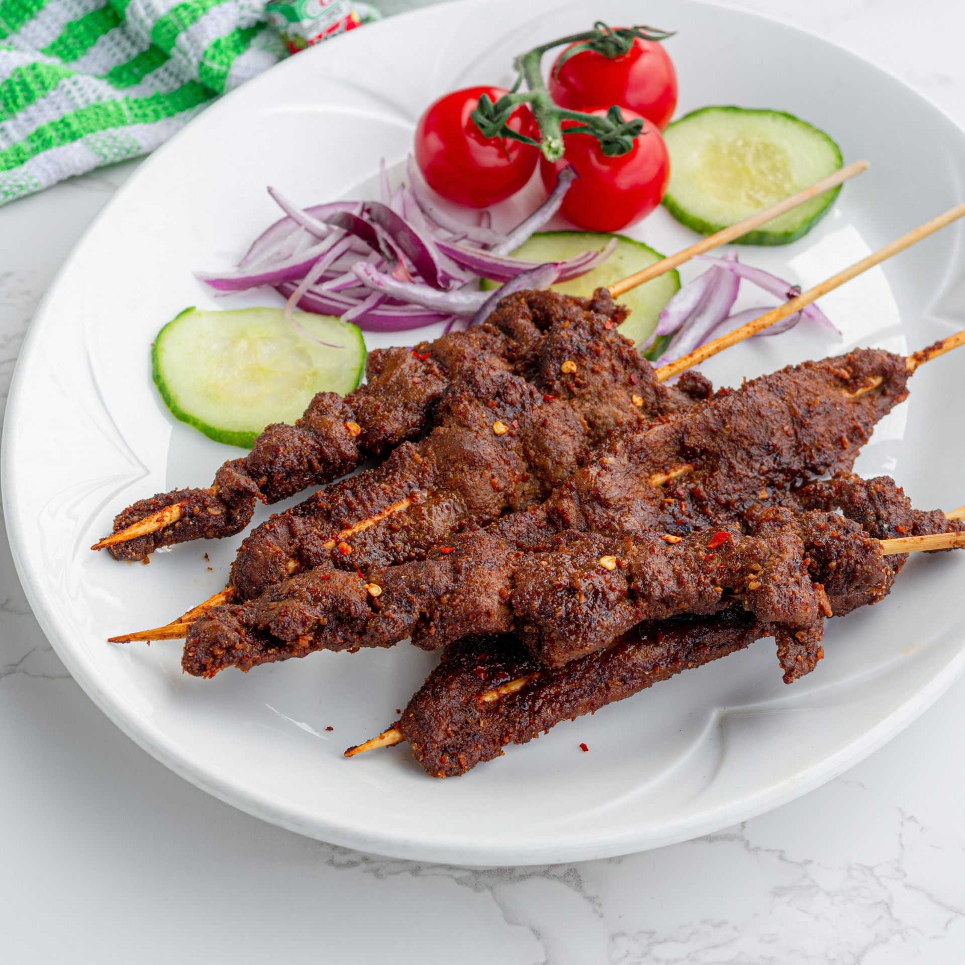 <p><span>A traditional Nigerian street food, Suya is grilled skewered beef, ram, or chicken marinated in a spicy peanut sauce.</span></p><p><a href="https://www.msn.com/en-us/community/channel/vid-7xx8mnucu55yw63we9va2gwr7uihbxwc68fxqp25x6tg4ftibpra?cvid=94631541bc0f4f89bfd59158d696ad7e">Follow us and access great exclusive content every day</a></p>