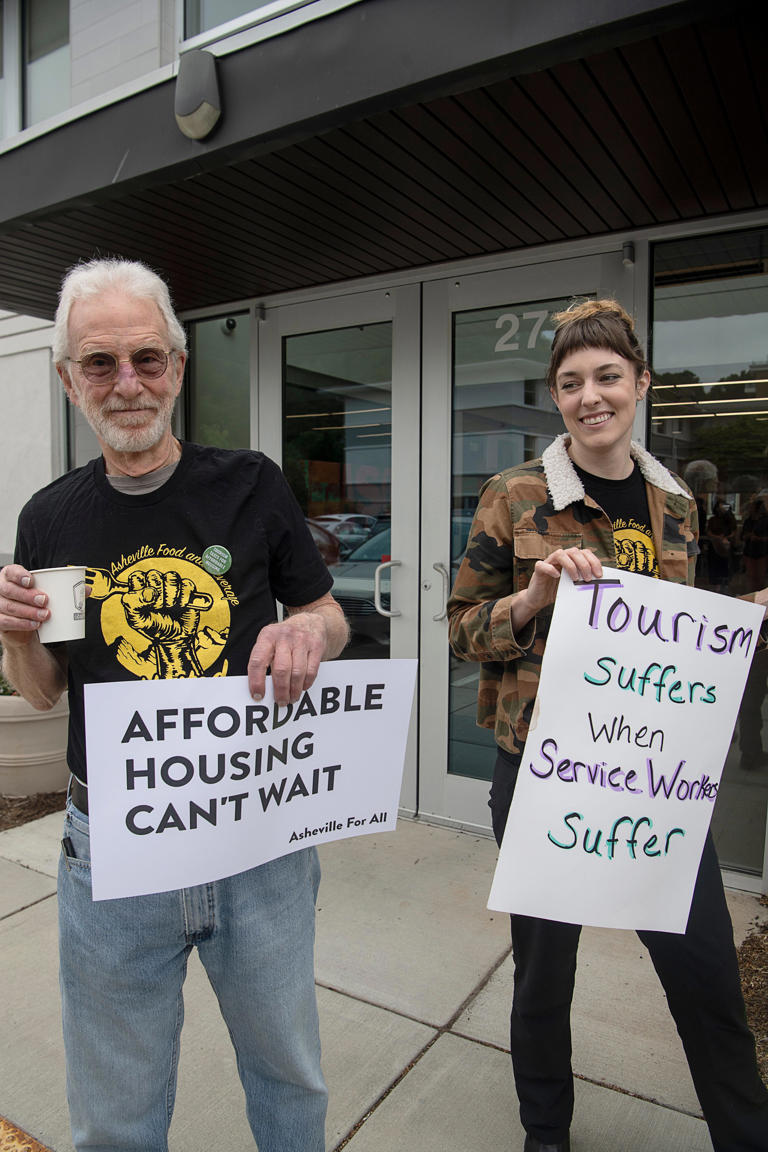 Asheville community members rallied for affordable housing before entering the Buncombe County Tourism Development Authority meeting May 31, 2023.