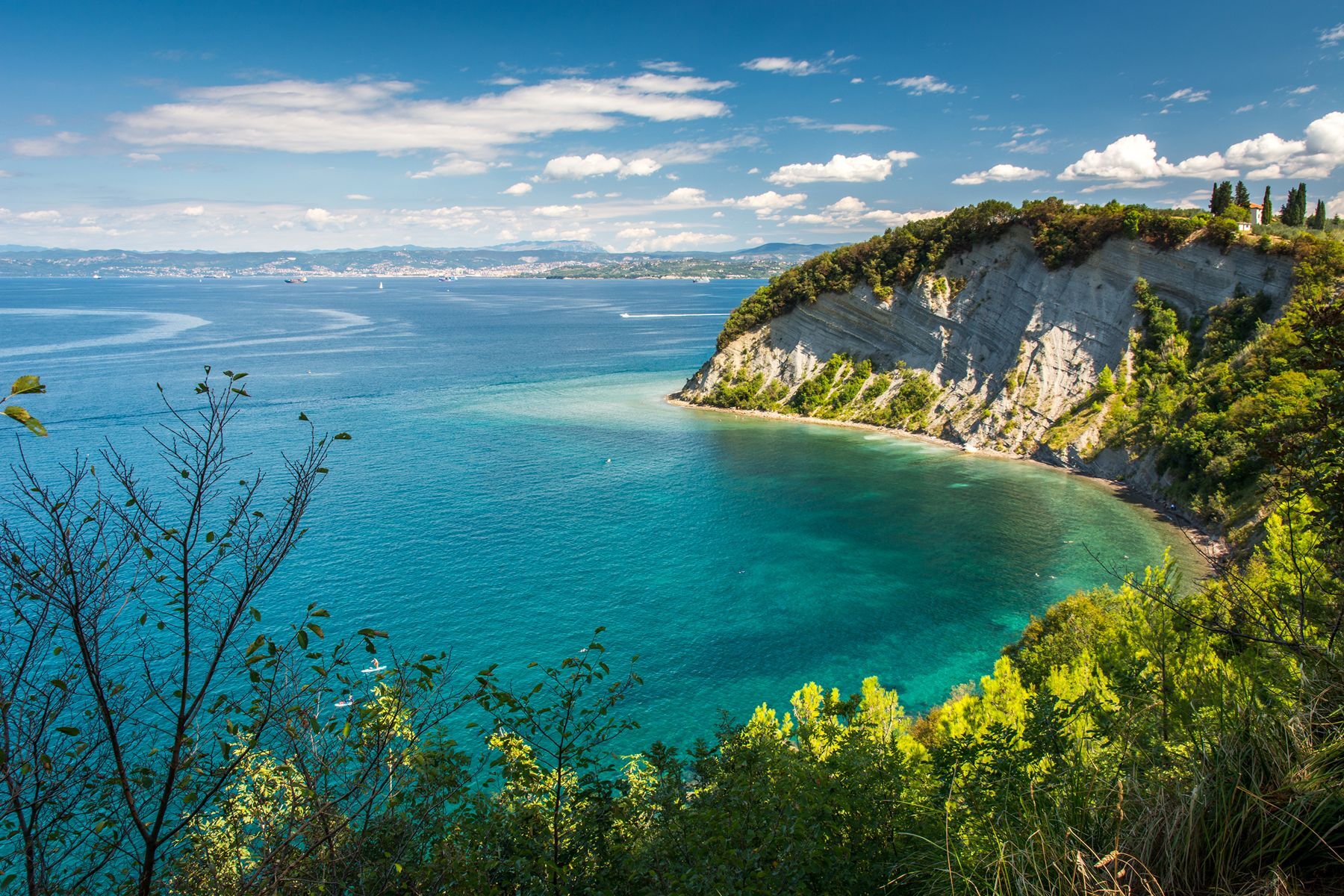 <p>For a picturesque coastal getaway in southwest Slovenia, you’ll want to add the <a href="https://www.naravniparkislovenije.si/en/nature-parks/strunjan-landscape-park">Strunjan Landscape Park</a> to your itinerary. The nature reserve boasts sheer cliffs that plunge into the Adriatic Sea and hiking trails full of interesting flora and fauna that are sure to delight nature enthusiasts. If you’d rather spend a day relaxing in the sun, head to the reserve’s sublime <a href="https://www.portoroz.si/en/experience/activities/beaches/4464-object-moon-bay-or-the-bay-of-the-cross">Moon Bay beach</a> for a refreshing swim in an unspoilt environment.</p>