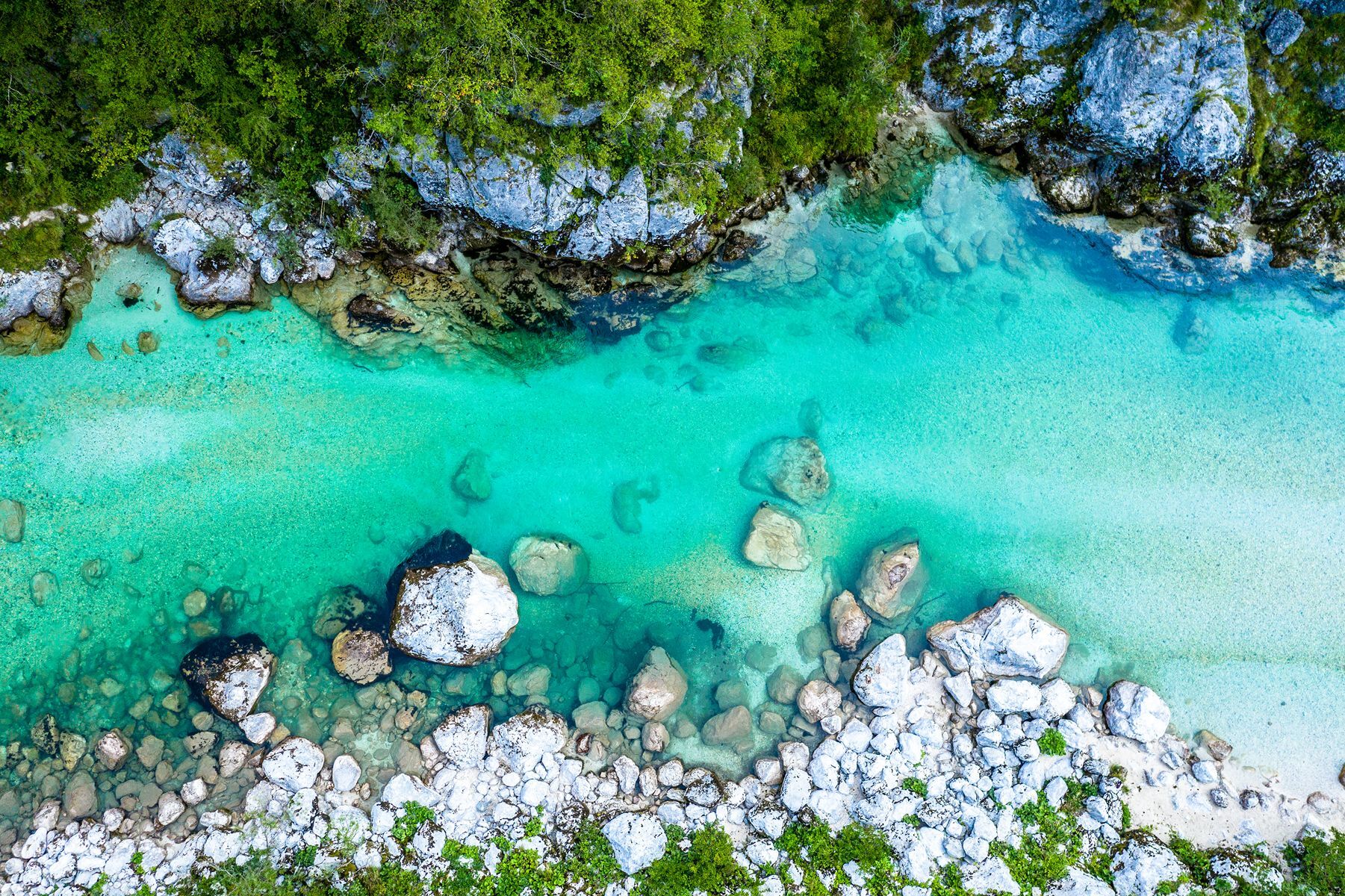 <p>The <a href="https://www.soca-valley.com/en/soca-valley/">Soča Valley</a> offers breathtaking scenery, and is well known for the crystal waters of the Soca River, which cuts through Slovenia’s mountainscapes. If you plan on rafting or kayaking along the <a href="https://www.slovenia.info/en/places-to-go/attractions/soca-valley">Soča River</a>, the pretty village of Bovec is an excellent starting point. History buffs will be captivated by the remnants of World War I trenches—a reminder of the region’s tumultuous past. Located in western Slovenia, the Soča Valley shines brightest in spring and summer, when wildflowers carpet its meadows in a blaze of colour. </p>