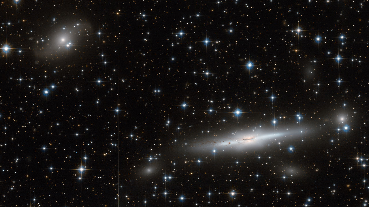 <p>Scientists have discovered that our galaxy, along with thousands of others, is being pulled towards a mysterious region of space known as the Great Attractor. This invisible mass is estimated to be about 220 million light-years away and have the mass of a million billion suns. Despite its immense gravitational pull, scientists are unable to directly observe the Great Attractor due to its location behind the Milky Way’s Zone of Avoidance.</p>