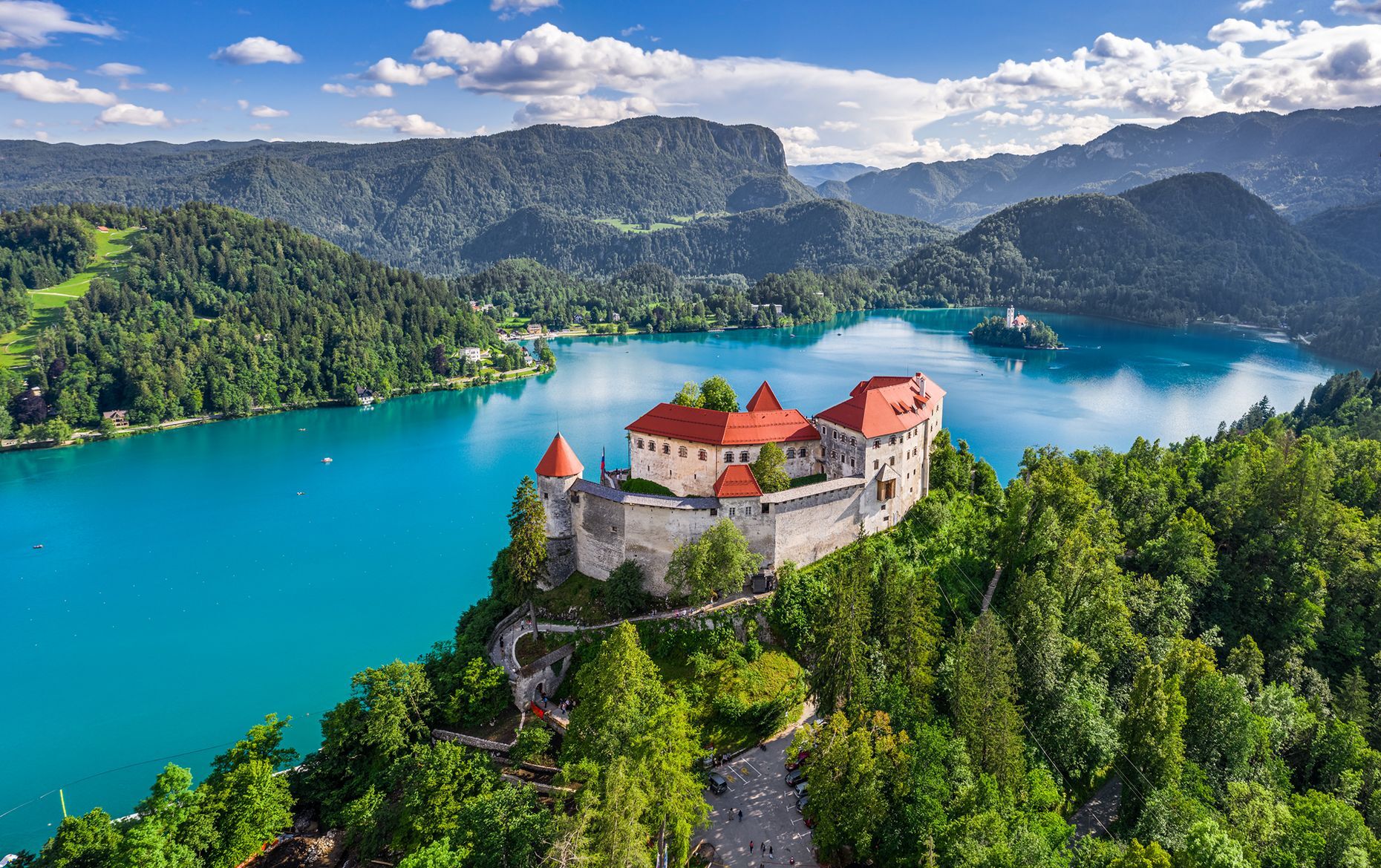 <p>Nestled in the heart of the Julian Alps, <a href="https://www.bled.si/en/">Bled</a> looks like something straight out of a fairytale. Book a traditional Slovenian boat, <a href="https://www.bled.si/en/what-to-see-do/attractions/38/pletna-boat/">called a <em>pletna</em></a>, to explore Bled Island and the area’s famous lake while admiring the surrounding mountains. You can also hike the alpine trails to the top of the cliff and visit Bled’s medieval castle, which offers an unrivalled view of the town. While you’re there, you have to try a piece of <em>kremna rezina</em>, a delicious local pastry brimming with cream and custard.</p>