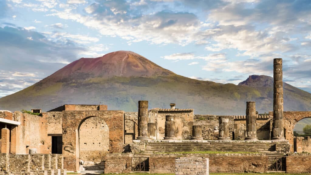 <p>If you want to learn more about Pompeii, the site of the Mount Vesuvius eruption in 79AD that destroyed the town, one of the best Italian coastal towns to visit is Herculaneum. While Pompeii welcomes thousands of visitors yearly, Herculeum is less prevalent. You may already see the more significant, popular site and want a quieter place. Herculeum is around 10 miles north of Pompeii. </p>