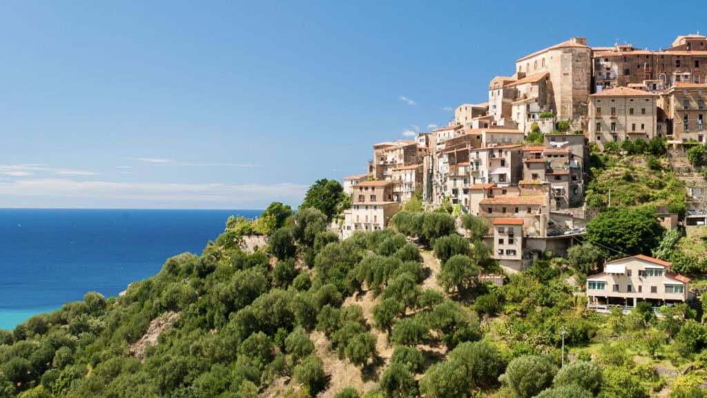 <p>As the country has around 7,900 km of sea-hugging land, Pisciotta is one of the best Italian coastal towns to visit and one that should be more popular. Located within the breathtaking Cilento National Park in the Campania region, the town and surrounding area are covered in beautiful olive groves. </p><p>The town is home to a fully reserved medieval urban plan. It features eye-catching stepped alleyways that date back centuries and lead to a collection of tiny houses, piazzas, hidden chapels, and a castle on top of the hill. Mythology and legends of the town state that it was established by the Trojans, who survived the fall of the ancient city of Troy. </p>